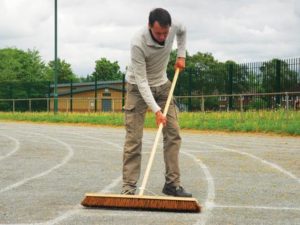 Groundsman sweeping